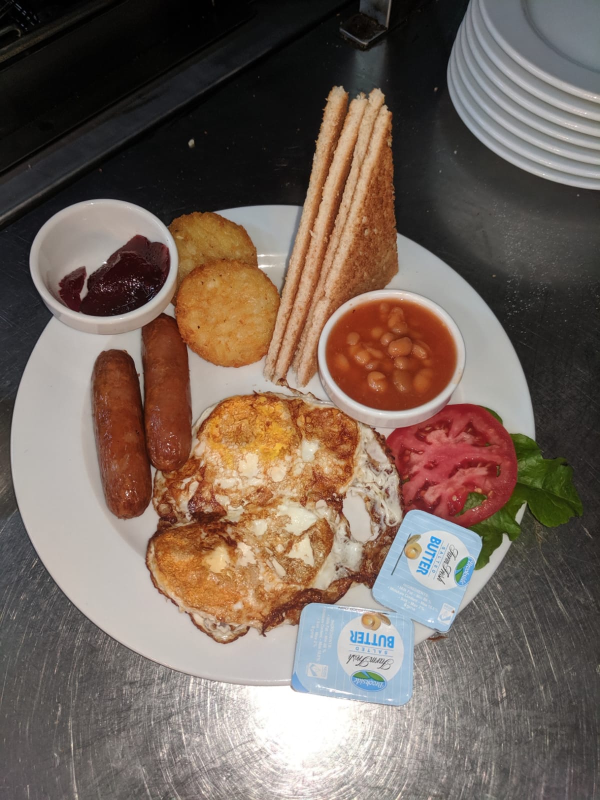 Full breakfast plate with eggs, sausage and toast